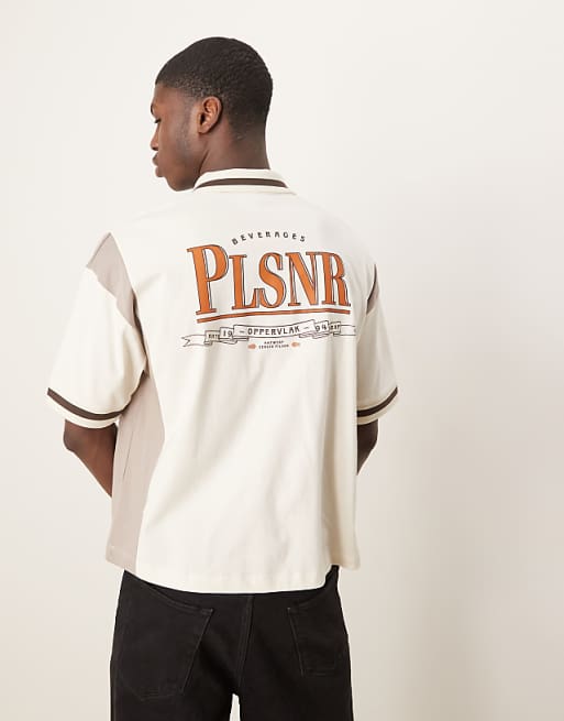 ASOS DESIGN boxy oversized zipped polo with cut and sew panelling and text graphic in cream