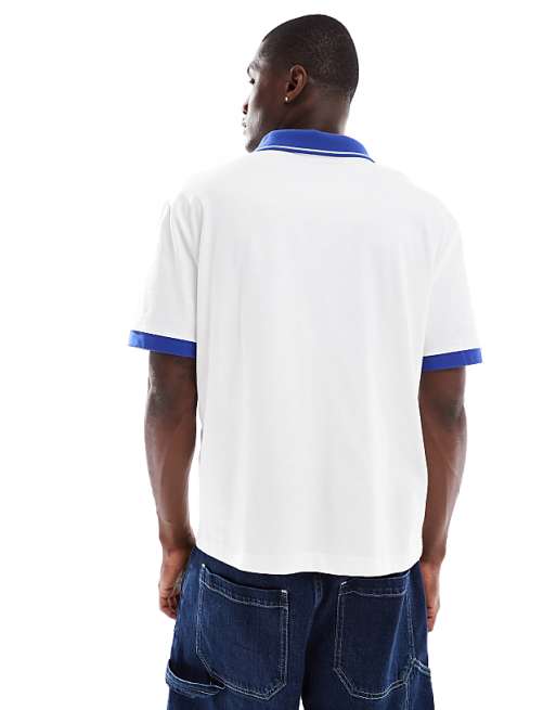ASOS DESIGN Boxy Relaxed Polo With City Graphic And Panelling In White And Blue