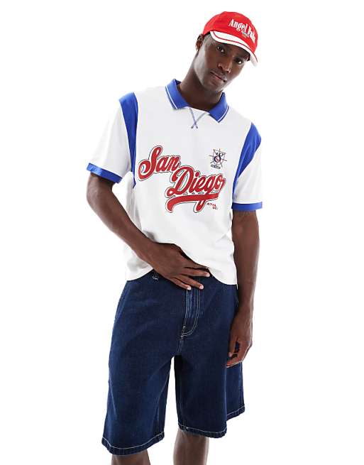 ASOS DESIGN boxy relaxed polo with city graphic and panelling in white and blue