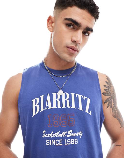 ASOS DESIGN boxy relaxed vest in blue with chest print