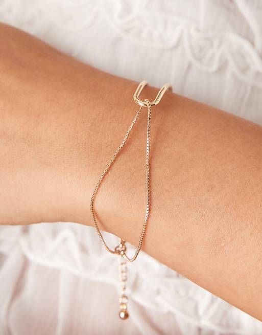 ASOS DESIGN bracelet with dainty cuff and chain detail in gold tone
