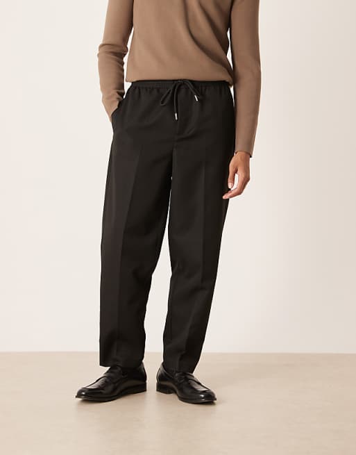ASOS DESIGN carrot fit trousers with elasticated waistband in black