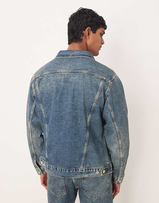 ASOS DESIGN Co-ord Denim Trucker Jacket In Mid Wash Blue With Yellow Tint