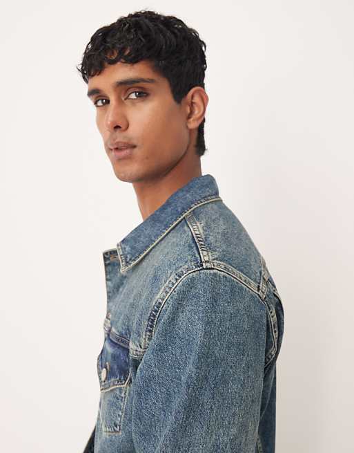 ASOS DESIGN Co-ord Denim Trucker Jacket In Mid Wash Blue With Yellow Tint