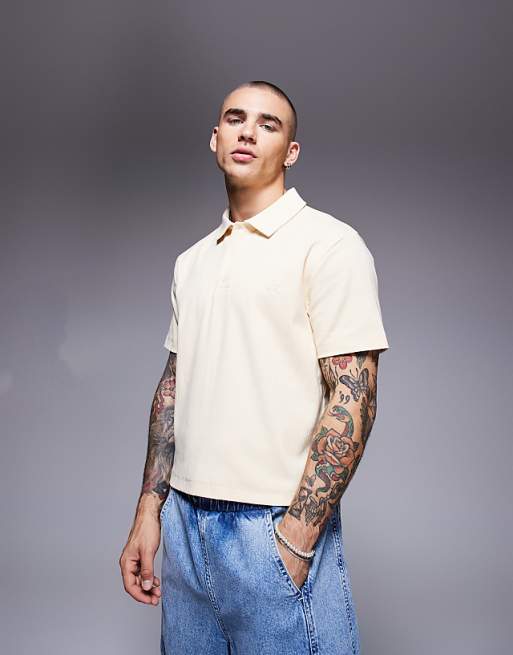 ASOS DESIGN cropped polo with chest embroidery in pale yellow rib
