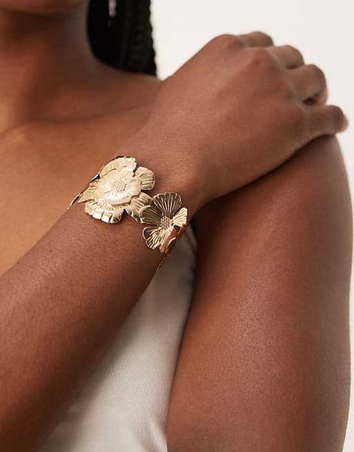 ASOS DESIGN cuff bracelet with floral detail in gold tone
