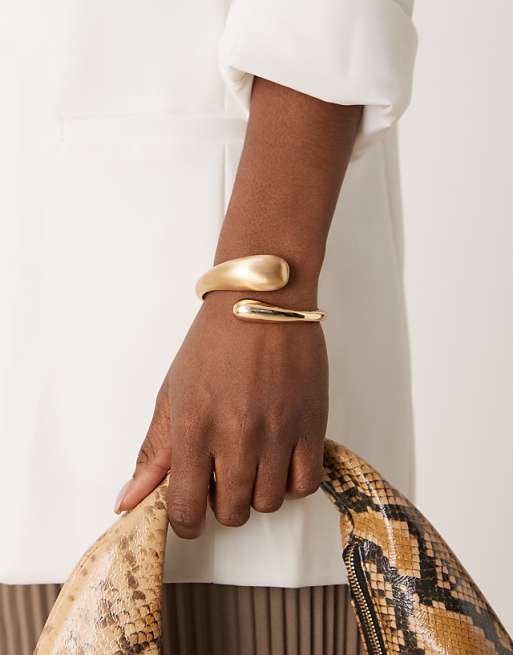 ASOS DESIGN cuff bracelet with wrap around molten detail with shiny and brushed gold tone