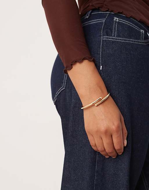 ASOS DESIGN Curve cuff bracelet with wrap detail in gold tone