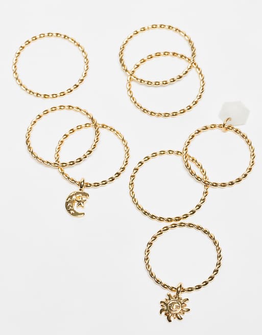ASOS DESIGN Curve multi-pack of rings with pendant charms detail in gold tone