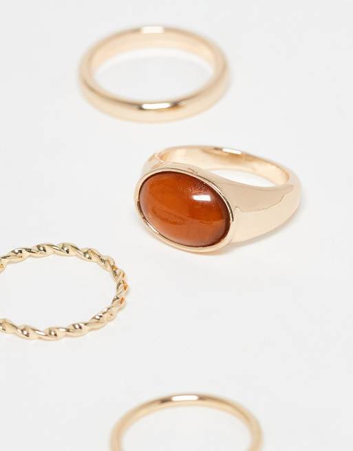 ASOS DESIGN Curve Pack Of 4 Mixed Rings With Faux Semi Precious Stone In Gold Tone