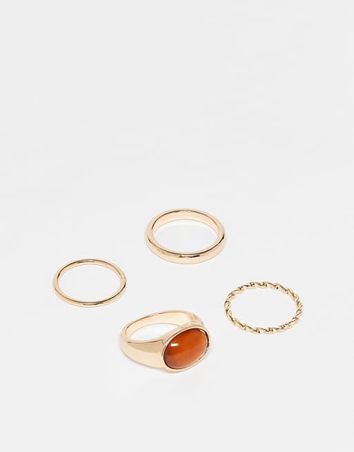 ASOS DESIGN Curve pack of 4 mixed rings with faux semi precious stone in gold tone