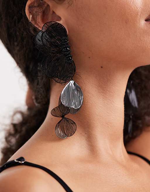ASOS DESIGN half petal statement earrings in black