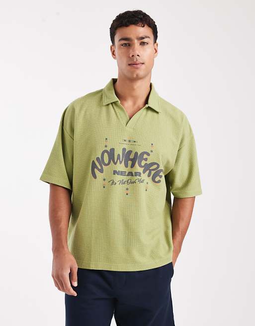 ASOS DESIGN heavyweight boxy oversized polo with text graphic in green texture