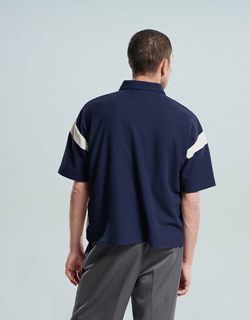 ASOS DESIGN Heavyweight Boxy Waffle Texture Oversized Polo With Panelling And Chest Print In Navy