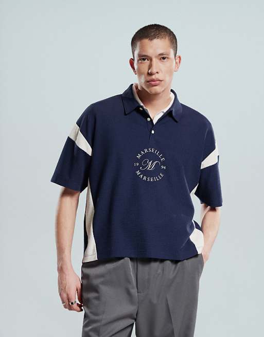 ASOS DESIGN heavyweight boxy waffle texture oversized polo with panelling and chest print in navy