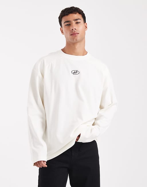 ASOS DESIGN heavyweight oversized long sleeve t-shirt with printed chest badge and cut a sew detail in cream