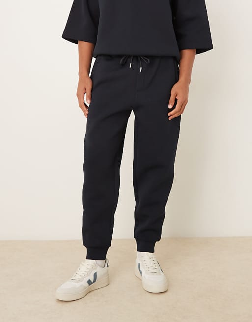 ASOS DESIGN heavyweight tapered fit jogger in scuba-style fabric in navy