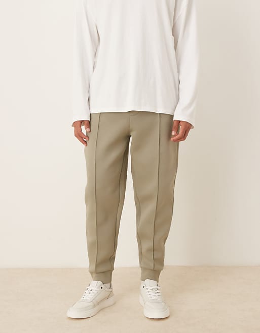 ASOS DESIGN heavyweight tapered joggers in scuba-style fabric with pin tucks in khaki