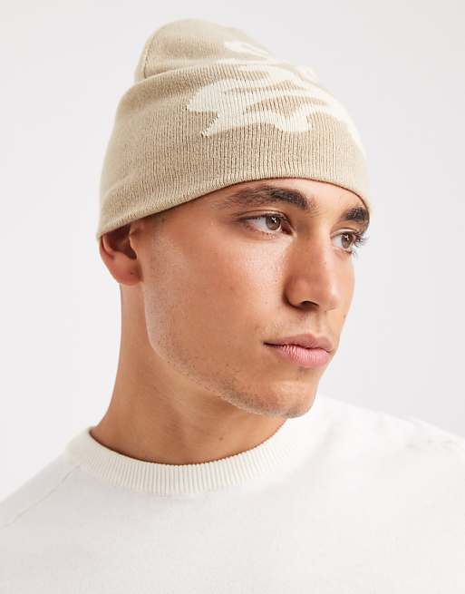ASOS DESIGN knitted graffiti graphic skull beanie in neutral