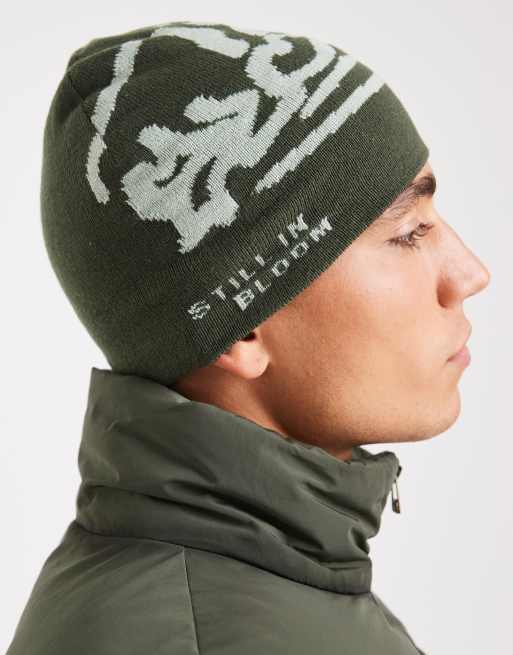 ASOS DESIGN Knitted Graphic Skull Beanie In Khaki Green