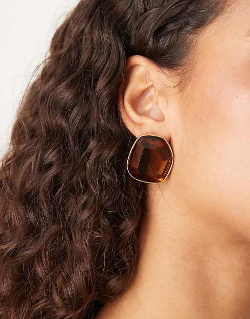 ASOS DESIGN large stud earrings with faux crystal design in amber tone