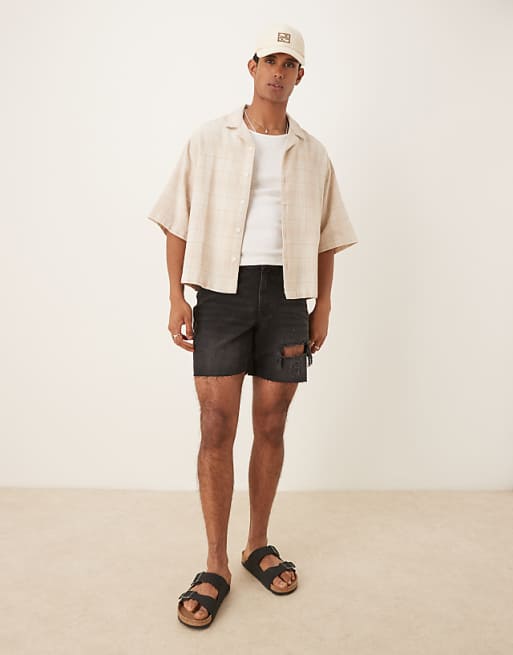 ASOS DESIGN mid length slim denim shorts with rips in black