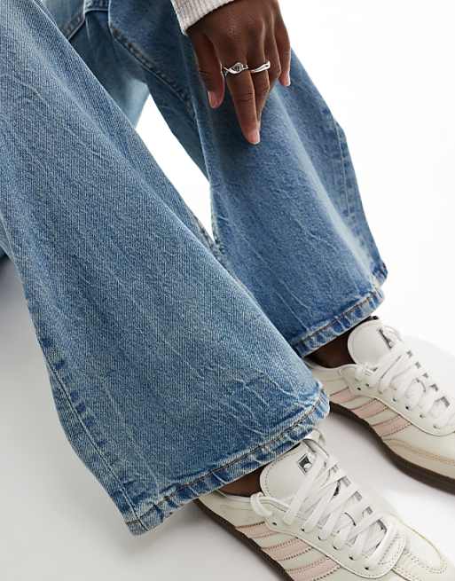 ASOS DESIGN Mid Rise Flare Jeans In Light Vintage Wash