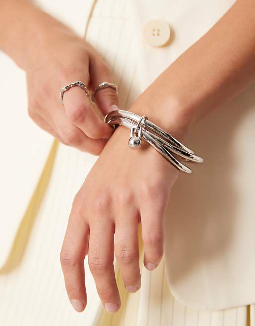 ASOS DESIGN multi-row bangle with spherical ring detail in silver tone