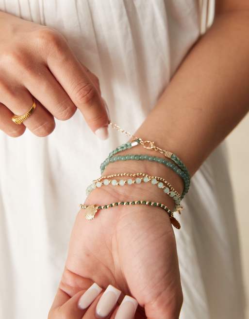 ASOS DESIGN Multirow Bracelet In Shell Design In Gold Tone