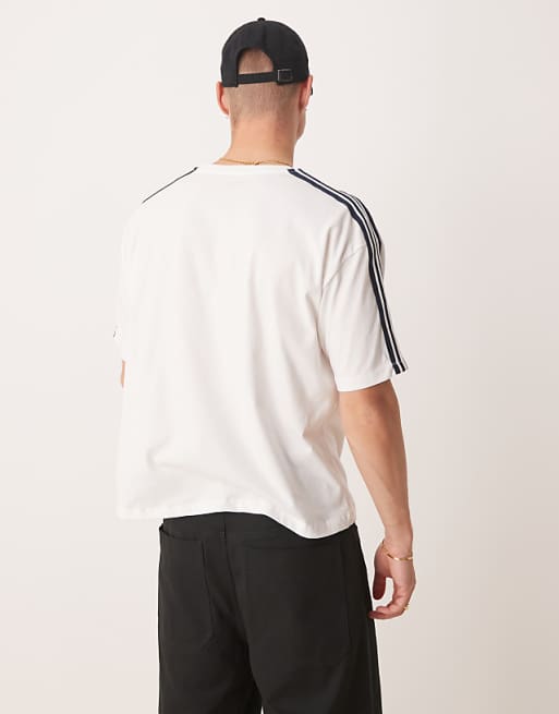 ASOS DESIGN Oversized Boxy T-shirt With Sport Graphic And Tape In White