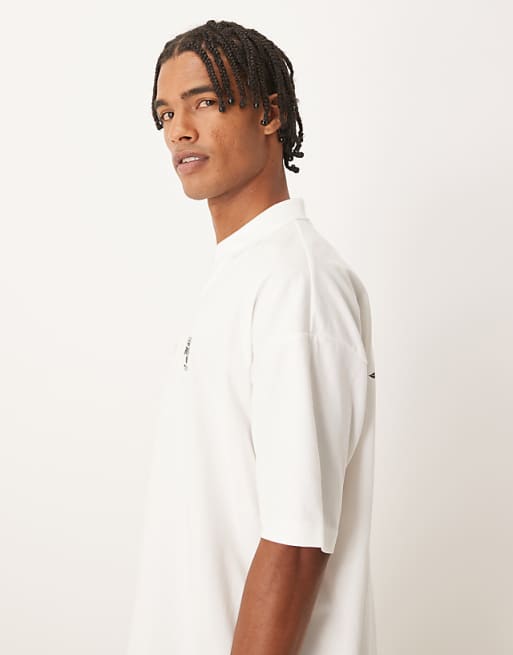 ASOS DESIGN Oversized Polo With Back And Front Crest Print In Cream