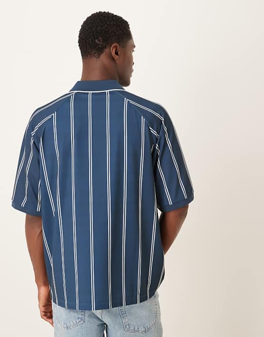 ASOS DESIGN Oversized Polo With Sports Graphic In Navy Striped Sports Fabric