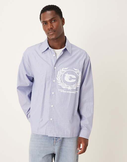 ASOS DESIGN oversized shirt with chest print in blue and white stripe