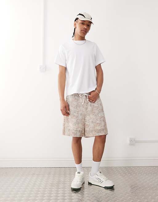 ASOS DESIGN oversized short with all over foliage print in beige
