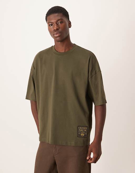 ASOS DESIGN oversized t-shirt with woven tab in green
