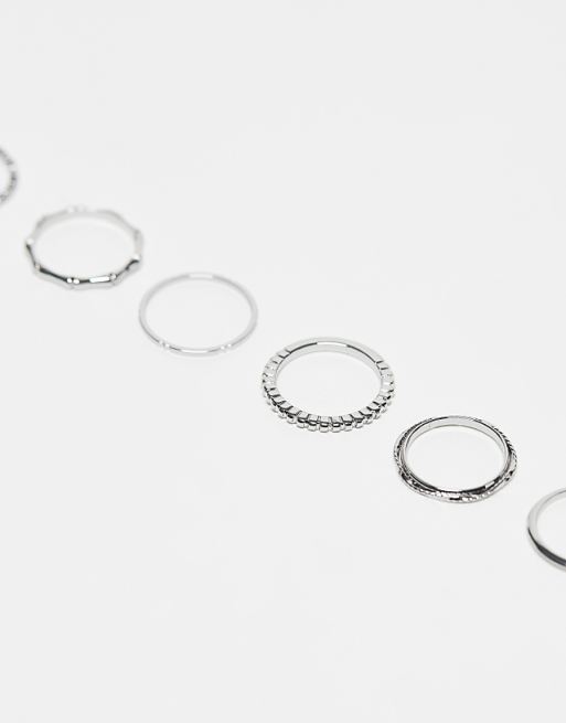 ASOS DESIGN Pack Of 12 Rings With Twist Details And Engraved Designs In Silver Tone
