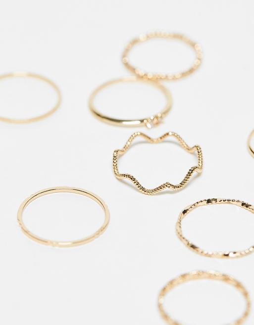 ASOS DESIGN Pack Of 12 Rings With Twist Details And Engraved Designs In Gold Tone