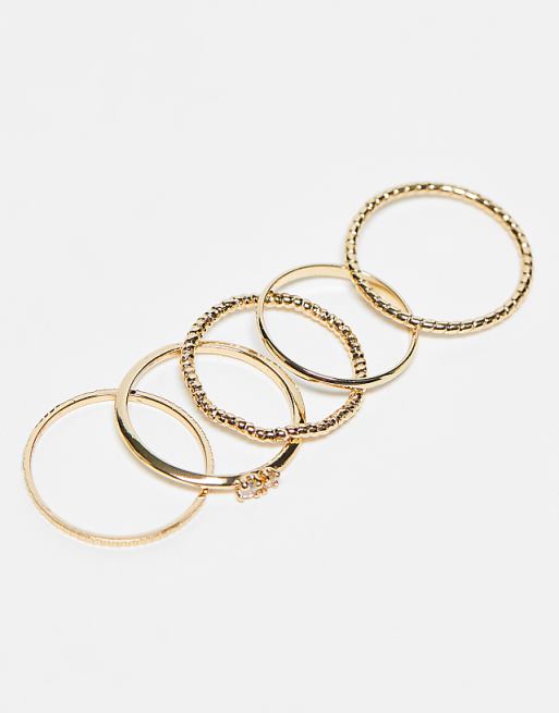 ASOS DESIGN Pack Of 12 Rings With Twist Details And Engraved Designs In Gold Tone