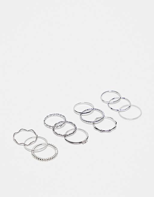 ASOS DESIGN pack of 12 rings with twist details and engraved designs in silver tone