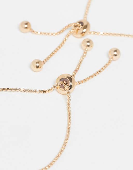 ASOS DESIGN Pack Of 2 Bracelets With Sun And Moon Charms In Gold Tone