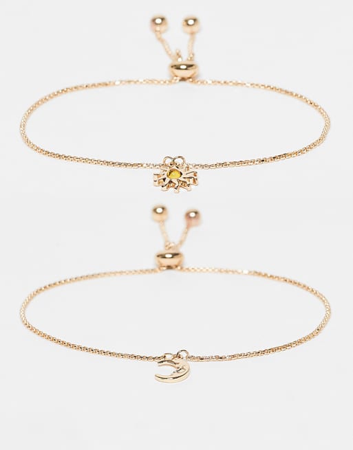 ASOS DESIGN pack of 2 bracelets with sun and moon charms in gold tone