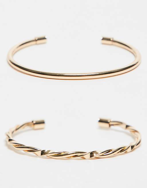 ASOS DESIGN pack of 2 cuff bracelets with plain and twist detail in gold tone