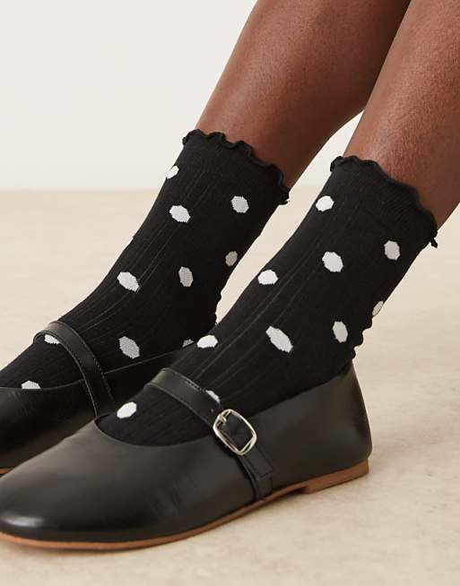 ASOS DESIGN polka dot socks with frill trim in black and white