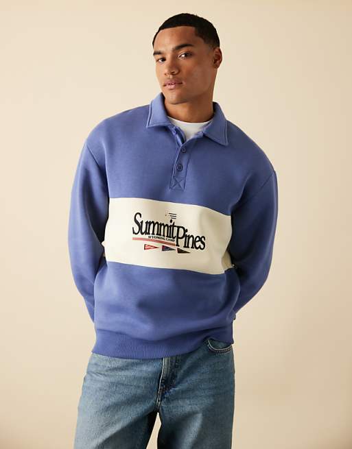 ASOS DESIGN polo sweatshirt with contrast panel and print in blue