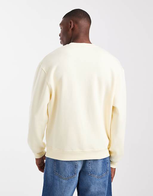 ASOS DESIGN Relaxed Fit Sweatshirt With Distressed Text Embroidery In Pale Yellow