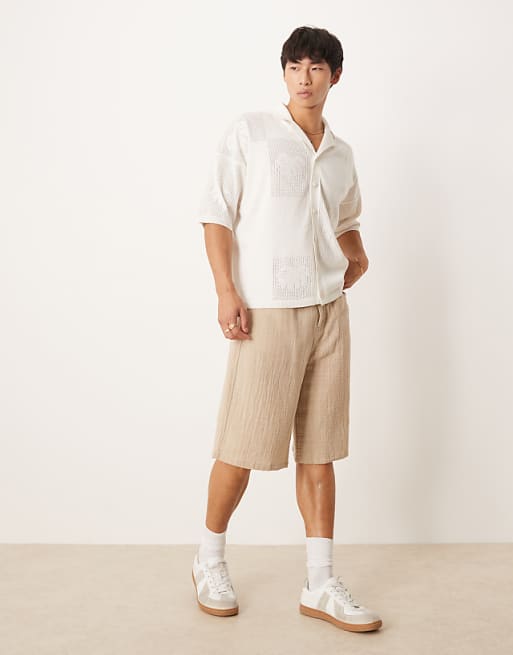 ASOS DESIGN Relaxed Knitted Textured Floral Button Through Polo In Cream