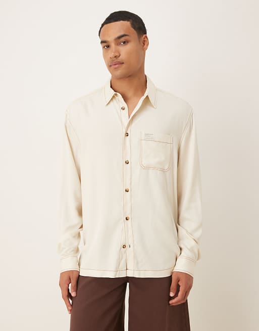 ASOS DESIGN relaxed shirt in cream with contrast stitching and badge detail