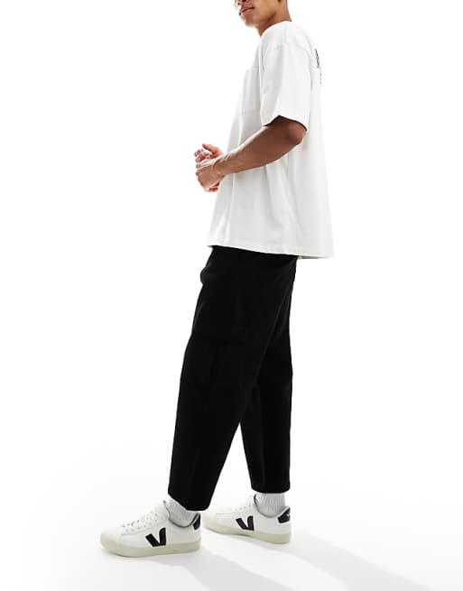 ASOS DESIGN relaxed tapered cargo trousers in black with pleats