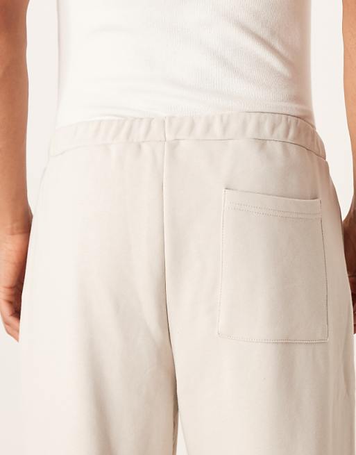 ASOS DESIGN Relaxed Tapered Joggers With Pleats In Stone