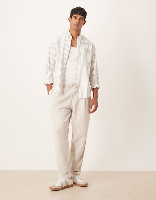 ASOS DESIGN relaxed tapered joggers with pleats in stone